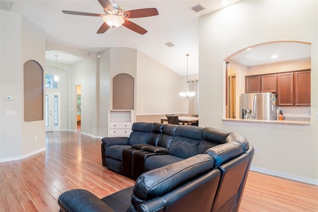12721 Avelar Creek Dr, Riverview, FL 33578 - living area featuring arched walkways, light wood finished floors, a ceiling fan, recessed lighting, and lofted ceiling