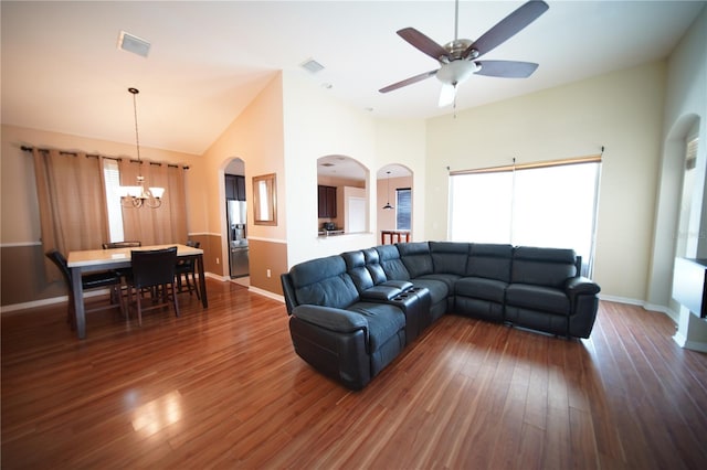 12721 Avelar Creek Dr, Riverview, FL 33578 - living room featuring a chandelier, wood finished floors, a ceiling fan, arched walkways, and high vaulted ceiling
