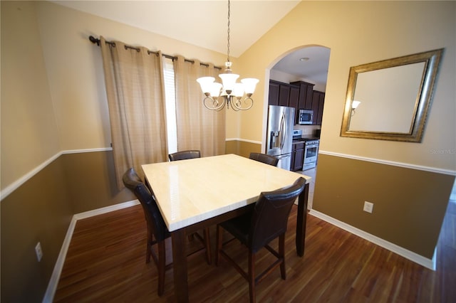 12721 Avelar Creek Dr, Riverview, FL 33578 - dining space featuring a chandelier, dark wood finished floors, arched walkways, and lofted ceiling