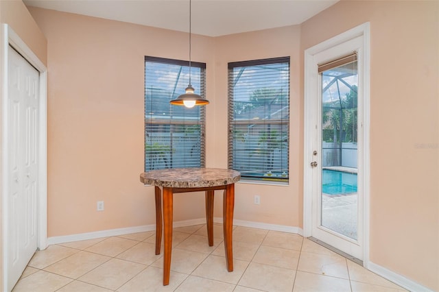 12721 Avelar Creek Dr, Riverview, FL 33578 - unfurnished dining area with baseboards and light tile patterned floors