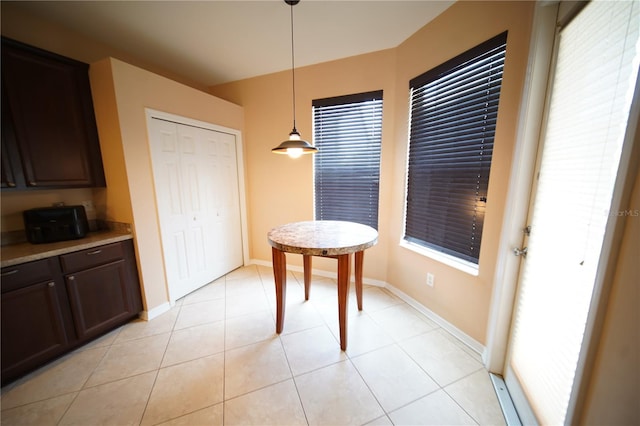 12721 Avelar Creek Dr, Riverview, FL 33578 - dining room featuring light tile patterned floors and baseboards