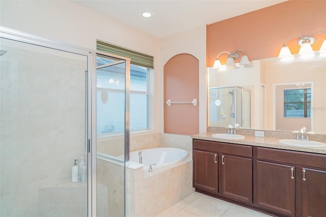 12721 Avelar Creek Dr, Riverview, FL 33578 - bathroom featuring a stall shower, a garden tub, double vanity, and tile patterned floors