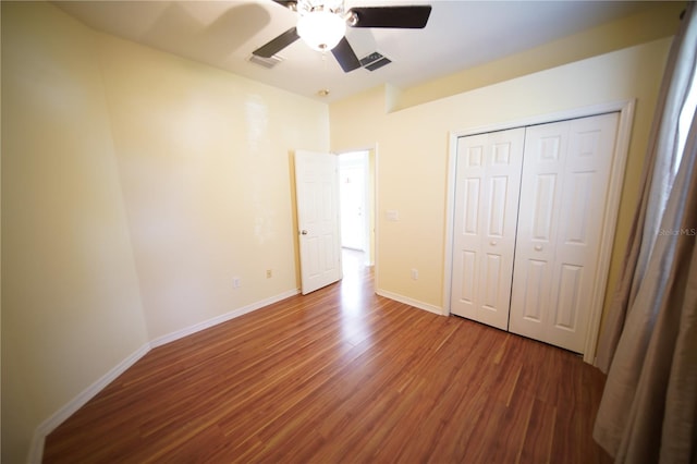 12721 Avelar Creek Dr, Riverview, FL 33578 - unfurnished bedroom with wood finished floors, a ceiling fan, and a closet