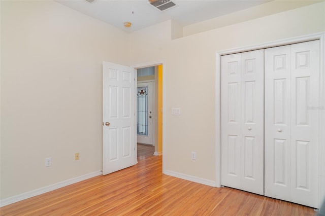 12721 Avelar Creek Dr, Riverview, FL 33578 - unfurnished bedroom featuring light wood-style floors and a closet