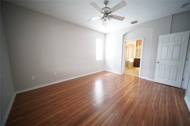 12721 Avelar Creek Dr, Riverview, FL 33578 - unfurnished bedroom featuring wood finished floors, connected bathroom, and ceiling fan