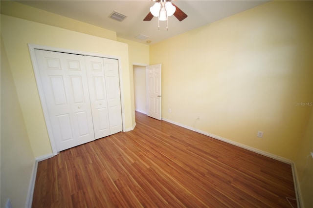 12721 Avelar Creek Dr, Riverview, FL 33578 - unfurnished bedroom featuring wood finished floors, a closet, and a ceiling fan
