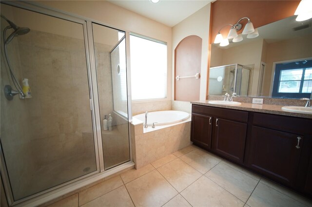 12721 Avelar Creek Dr, Riverview, FL 33578 - full bath with tile patterned flooring, a shower stall, double vanity, and a garden tub