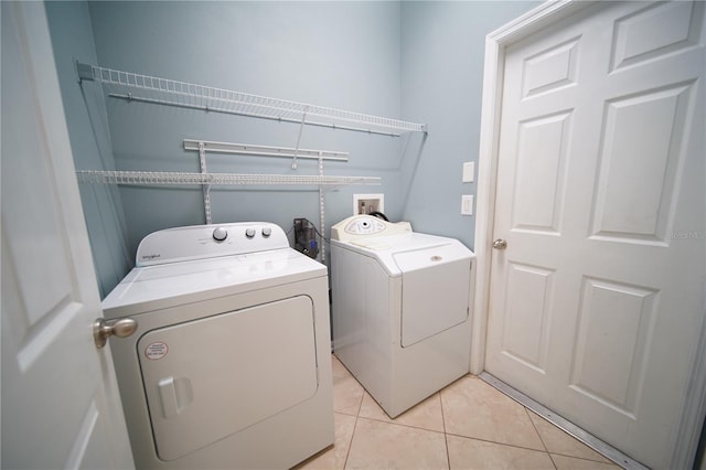 12721 Avelar Creek Dr, Riverview, FL 33578 - laundry room with washer and dryer and light tile patterned flooring