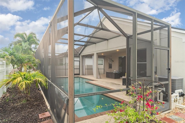 12721 Avelar Creek Dr, Riverview, FL 33578 - outdoor pool featuring glass enclosure and a patio