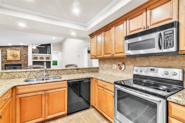 910 Kingscote Ct, Safety Harbor, FL 34695 - kitchen featuring stainless steel appliances, light stone countertops, light wood-style floors, tasteful backsplash, and open floor plan