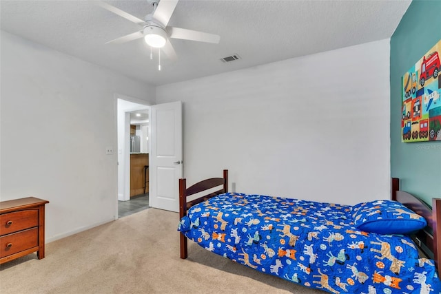 910 Kingscote Ct, Safety Harbor, FL 34695 - bedroom featuring carpet, a ceiling fan, and a textured ceiling