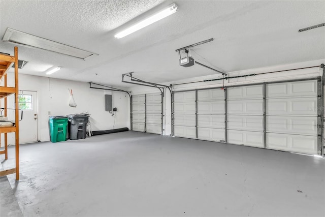 910 Kingscote Ct, Safety Harbor, FL 34695 - garage featuring a garage door opener and electric panel