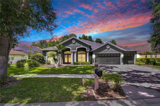 19307 Wind Dancer St, Lutz, FL 33558 - ranch-style house featuring a garage, driveway, stucco siding, and a front yard