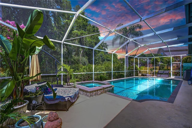 19307 Wind Dancer St, Lutz, FL 33558 - view of swimming pool featuring a patio area, a pool with connected hot tub, and a lanai