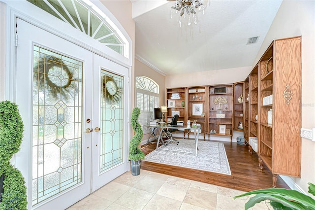 19307 Wind Dancer St, Lutz, FL 33558 - foyer featuring lofted ceiling, french doors, and a chandelier