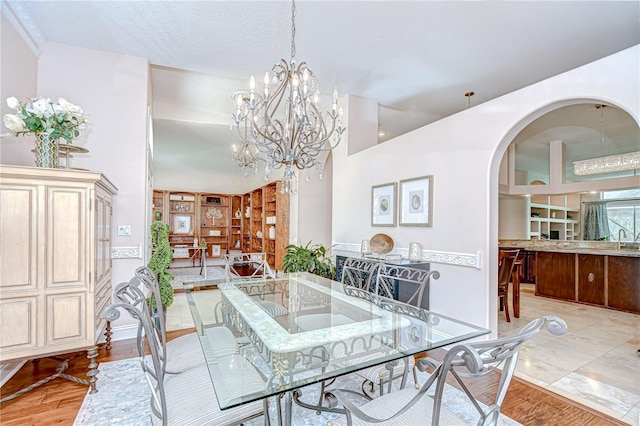 19307 Wind Dancer St, Lutz, FL 33558 - dining room featuring a chandelier and arched walkways