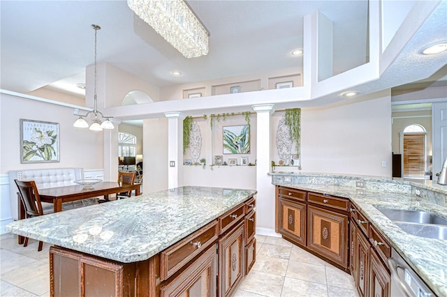19307 Wind Dancer St, Lutz, FL 33558 - kitchen featuring light stone counters, dishwasher, recessed lighting, light tile patterned floors, and pendant lighting