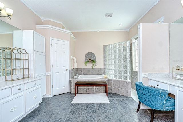 19307 Wind Dancer St, Lutz, FL 33558 - bathroom featuring ornamental molding, a garden tub, tile patterned floors, and vanity