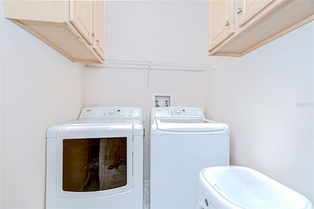 19307 Wind Dancer St, Lutz, FL 33558 - laundry room with washer and clothes dryer and cabinet space