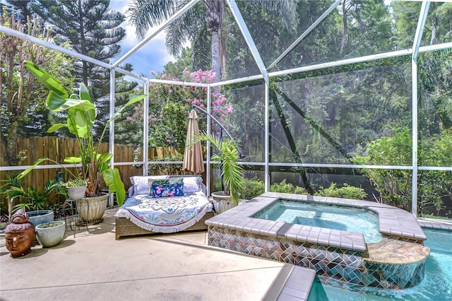 19307 Wind Dancer St, Lutz, FL 33558 - outdoor pool featuring a fenced backyard, a patio, an in-ground hot tub, and glass enclosure