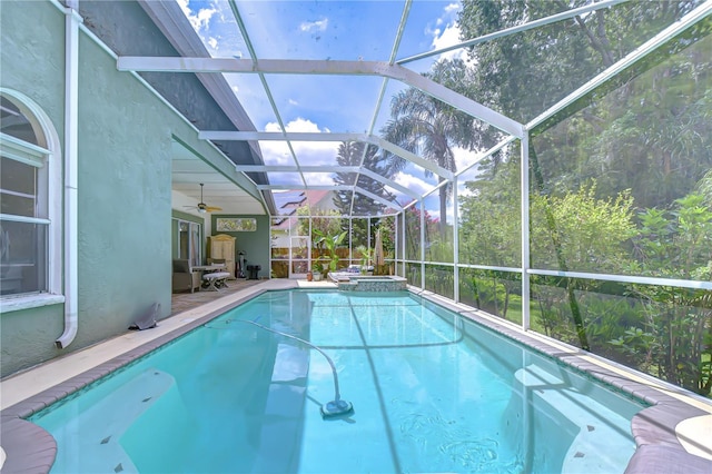 19307 Wind Dancer St, Lutz, FL 33558 - view of pool featuring a ceiling fan, a pool with connected hot tub, glass enclosure, and a patio