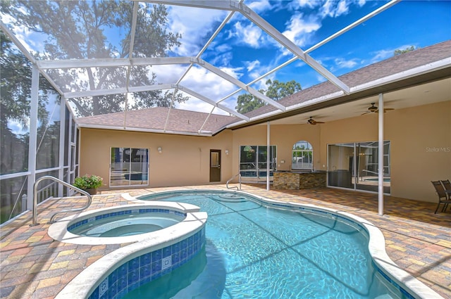 2504 Oak Landing Dr, Brandon, FL 33511 - view of swimming pool with a patio, a ceiling fan, a pool with connected hot tub, and glass enclosure