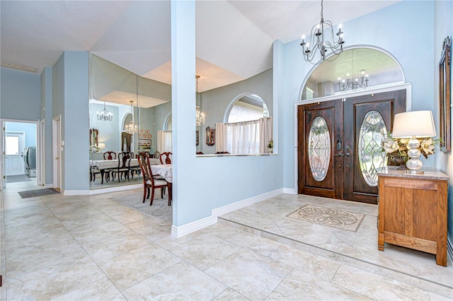 2504 Oak Landing Dr, Brandon, FL 33511 - foyer entrance with a chandelier, marble finish flooring, lofted ceiling, and french doors
