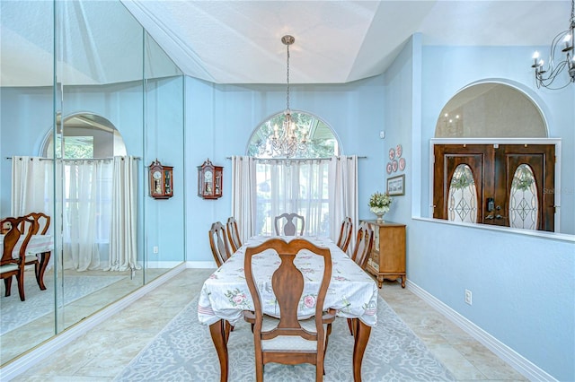 2504 Oak Landing Dr, Brandon, FL 33511 - dining space featuring a chandelier, healthy amount of natural light, and arched walkways
