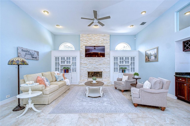 2504 Oak Landing Dr, Brandon, FL 33511 - living area featuring a ceiling fan and a stone fireplace