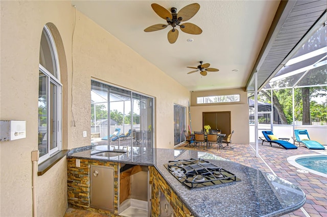 2504 Oak Landing Dr, Brandon, FL 33511 - view of patio / terrace featuring an outdoor kitchen, glass enclosure, a ceiling fan, and an outdoor pool