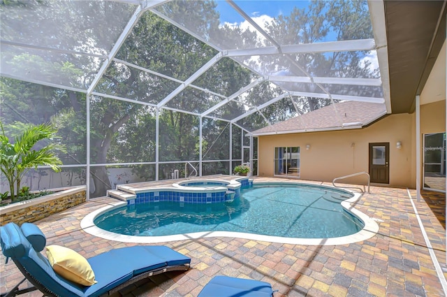 2504 Oak Landing Dr, Brandon, FL 33511 - view of swimming pool featuring a patio, a pool with connected hot tub, and glass enclosure