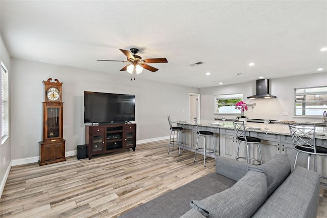 446 Eagle Cir, Casselberry, FL 32707 - living room with healthy amount of natural light, light wood-type flooring, ceiling fan, and recessed lighting