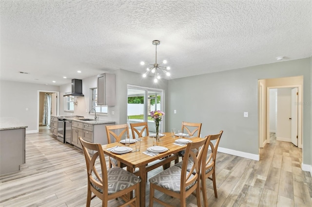 446 Eagle Cir, Casselberry, FL 32707 - dining space with light wood finished floors, a chandelier, a textured ceiling, and recessed lighting