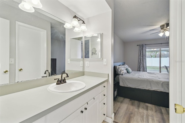 446 Eagle Cir, Casselberry, FL 32707 - ensuite bathroom featuring wood finished floors, vanity, and ceiling fan