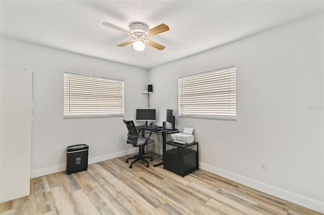 446 Eagle Cir, Casselberry, FL 32707 - home office featuring ceiling fan, wood finished floors, plenty of natural light, and a textured ceiling