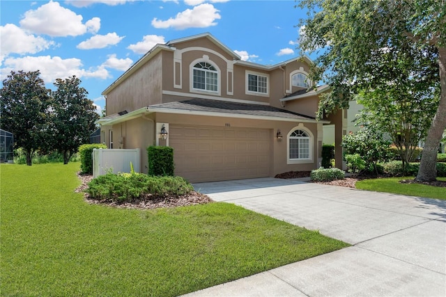 886 Suffolk Pl, Davenport, FL 33896 - traditional-style home featuring driveway, a front yard, stucco siding, and an attached garage