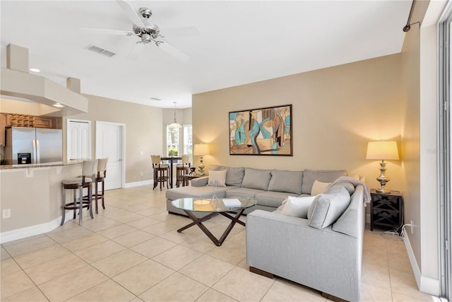 886 Suffolk Pl, Davenport, FL 33896 - living room with light tile patterned floors and ceiling fan