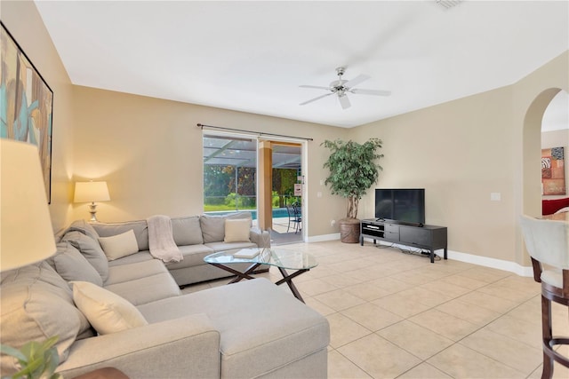 886 Suffolk Pl, Davenport, FL 33896 - living area featuring ceiling fan, arched walkways, and light tile patterned floors