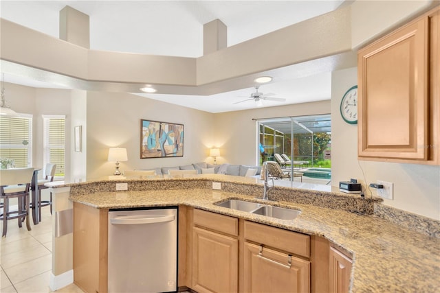 886 Suffolk Pl, Davenport, FL 33896 - kitchen with dishwasher, light brown cabinets, light stone countertops, open floor plan, and ceiling fan