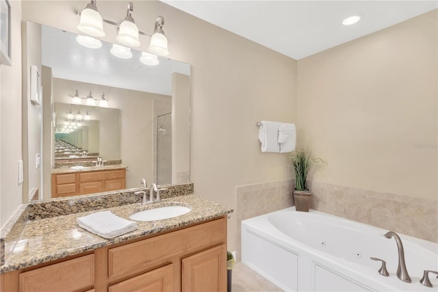 886 Suffolk Pl, Davenport, FL 33896 - bathroom with a whirlpool tub, a shower stall, and vanity
