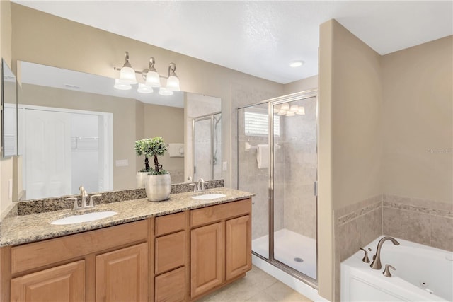 886 Suffolk Pl, Davenport, FL 33896 - bathroom featuring a shower stall, double vanity, a jetted tub, and tile patterned flooring