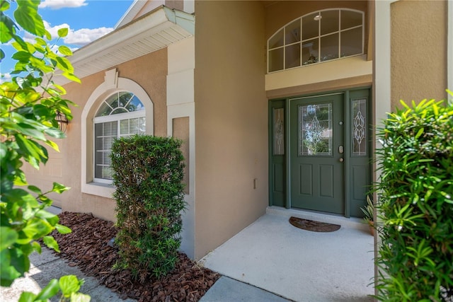 886 Suffolk Pl, Davenport, FL 33896 - view of exterior entry featuring stucco siding