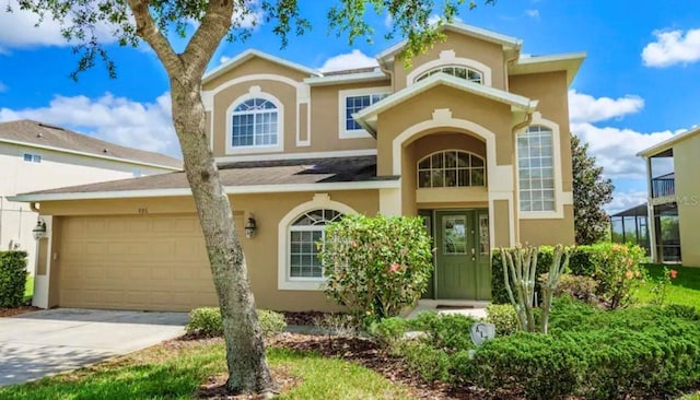 886 Suffolk Pl, Davenport, FL 33896 - mediterranean / spanish-style house featuring stucco siding, a garage, and concrete driveway