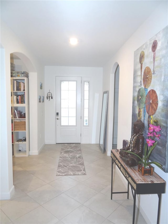 4957 Seafoam Trl, Bradenton, FL 34211 - foyer with arched walkways and light tile patterned floors