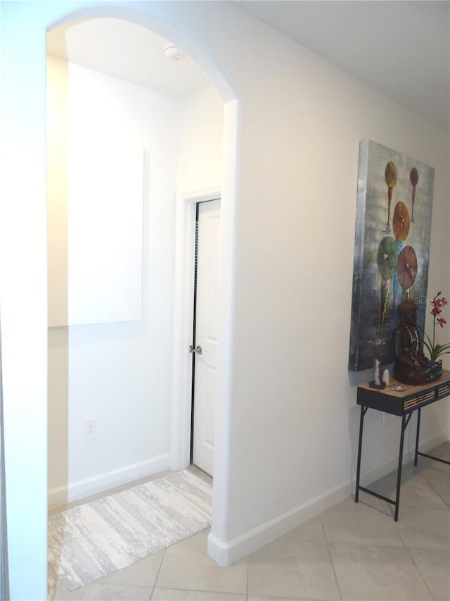 4957 Seafoam Trl, Bradenton, FL 34211 - hallway featuring arched walkways and light tile patterned floors