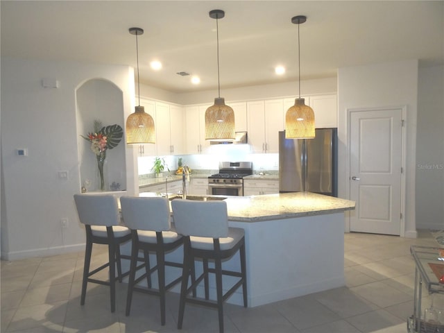 4957 Seafoam Trl, Bradenton, FL 34211 - kitchen with appliances with stainless steel finishes, white cabinets, light tile patterned flooring, pendant lighting, and recessed lighting