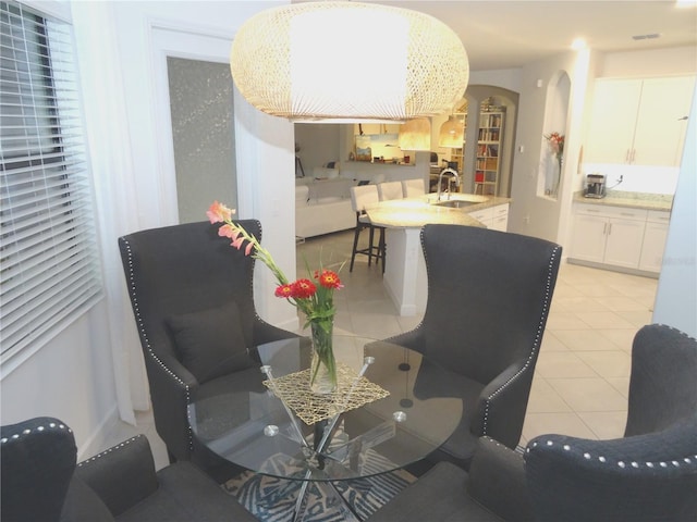 4957 Seafoam Trl, Bradenton, FL 34211 - dining room with arched walkways and light tile patterned flooring