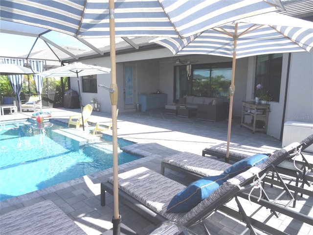 4957 Seafoam Trl, Bradenton, FL 34211 - swimming pool with an outdoor hangout area, a patio area, glass enclosure, and ceiling fan