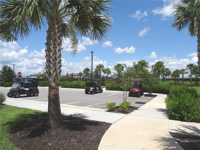4957 Seafoam Trl, Bradenton, FL 34211 - view of asphalt street featuring street lighting and traffic signs