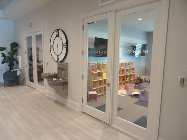 4957 Seafoam Trl, Bradenton, FL 34211 - entryway with french doors and wood finished floors